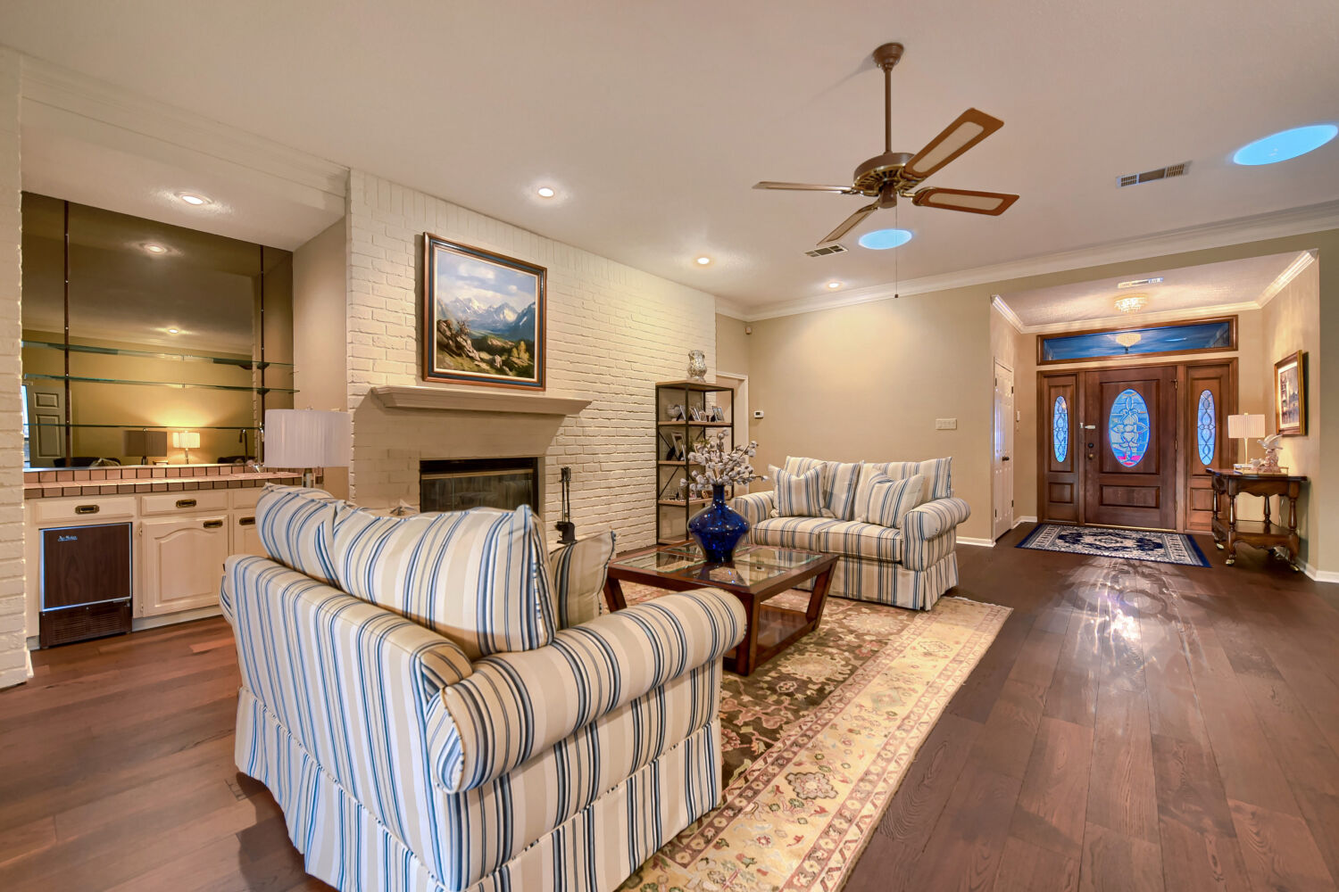 10904 Legends Lane Austin, TX 78747 - Photo 20 of 36 a living room with furniture fireplace and wooden floor
