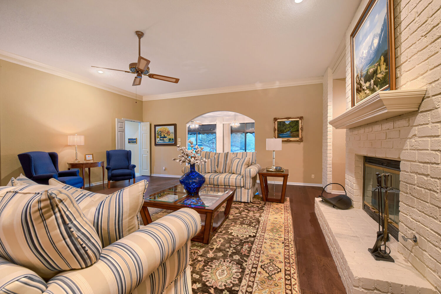 10904 Legends Lane Austin, TX 78747 - Photo 21 of 36 a living room with furniture a fireplace and a chandelier