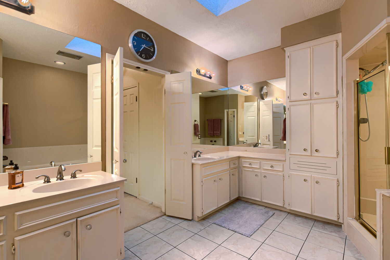 10904 Legends Lane Austin, TX 78747 - Photo 26 of 36 a spacious bathroom with a double vanity sink mirror and