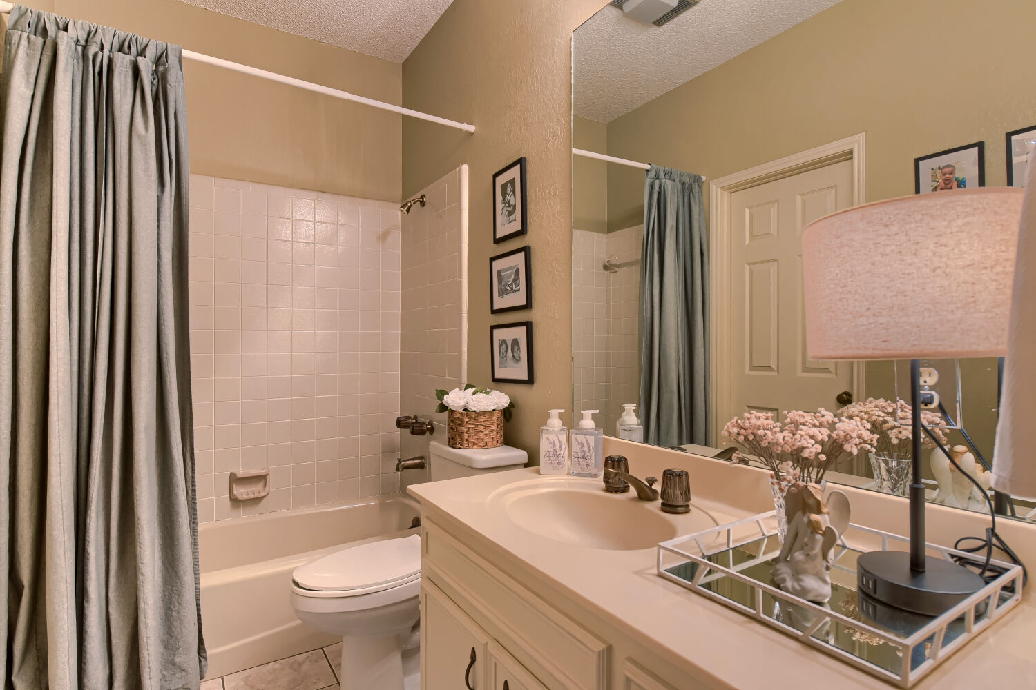 10904 Legends Lane Austin, TX 78747 - Photo 30 of 36 a bathroom with a granite countertop sink a toilet a mirror and shower