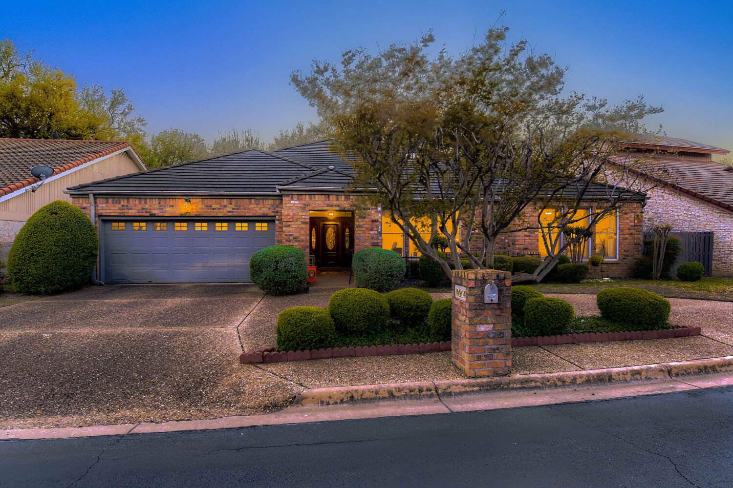 10904 Legends Lane Austin, TX 78747 - Photo 3 of 36 a front view of a house with garden