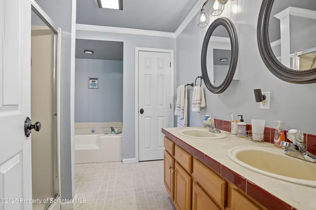 a bedroom with furniture and a large window