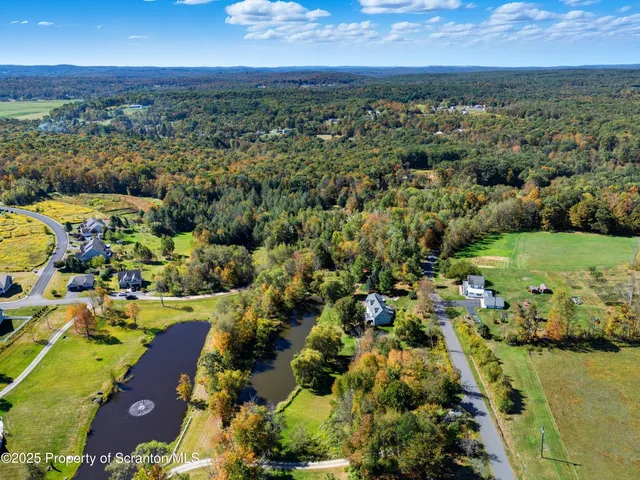 a view of a lake with houses in the background