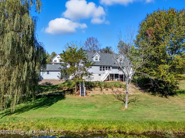 a view of a golf course with a big yard