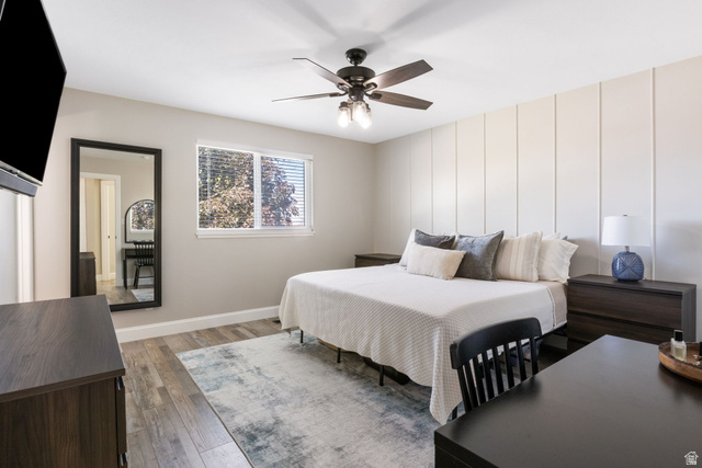415 360 East Salem, UT 84653 - Photo 7 of 20 Bedroom featuring wood-finish flooring, a contemporary ceiling fan with integrated lighting, and a window with blinds