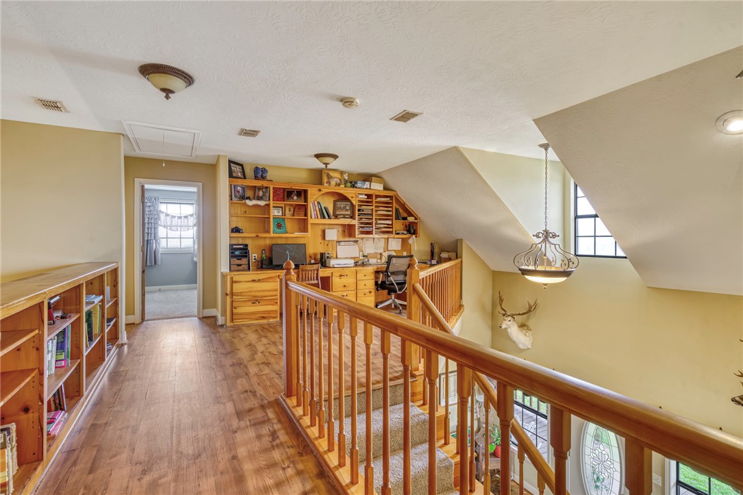 4404 County Road 151 Centerville, TX 75833 - Photo 21 of 48 a view of a hallway with wooden floor and stairs