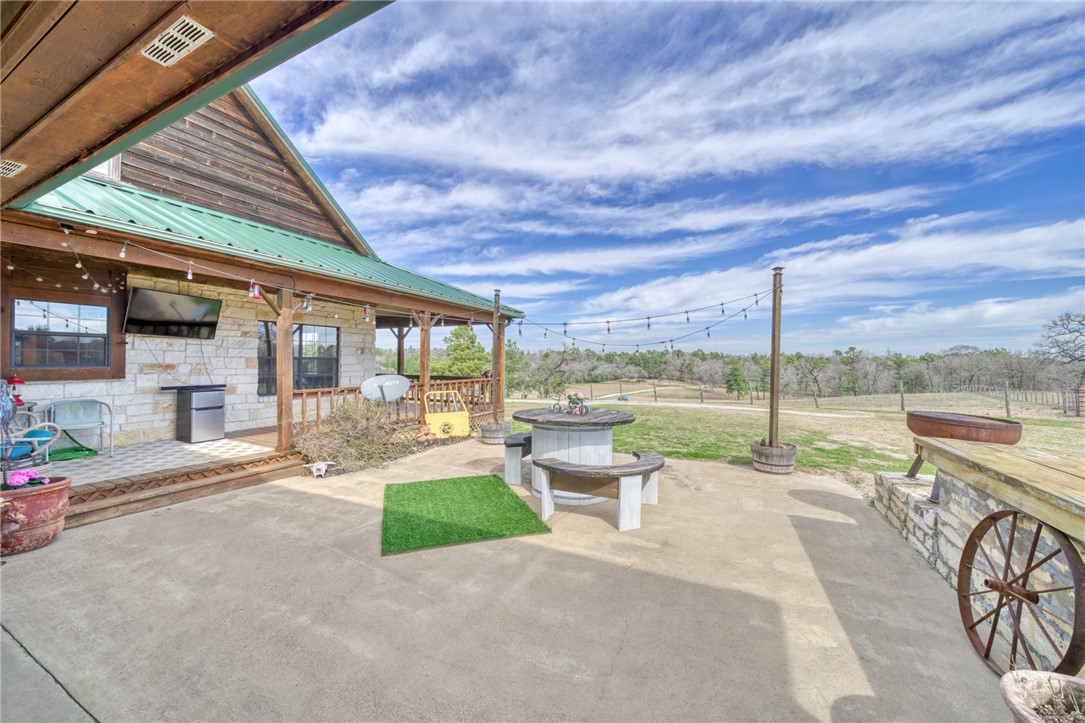 4404 County Road 151 Centerville, TX 75833 - Photo 25 of 48 a view of a patio with couches and table under an umbrella