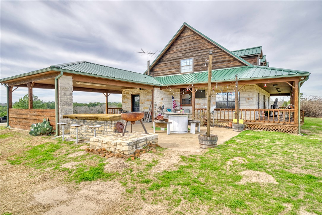 4404 County Road 151 Centerville, TX 75833 - Photo 26 of 48 a view of a backyard with a patio and dining space