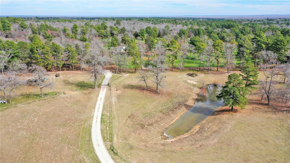 4404 County Road 151 Centerville, TX 75833 - Photo 42 of 48 a view of a swimming pool and a yard