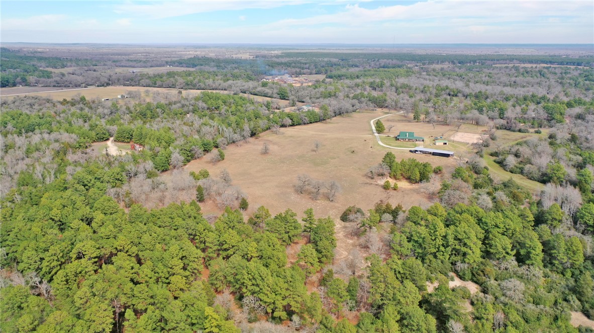 4404 County Road 151 Centerville, TX 75833 - Photo 46 of 48 an aerial view of a houses with a yard