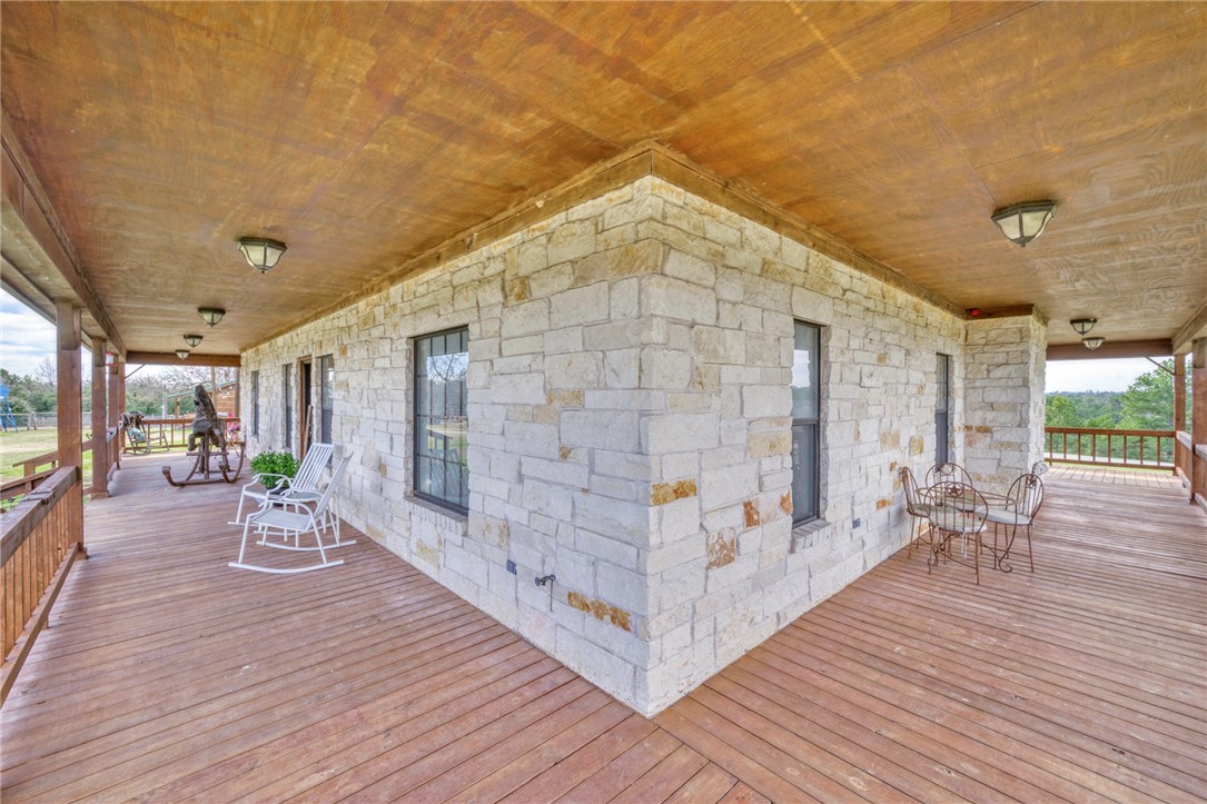 4404 County Road 151 Centerville, TX 75833 - Photo 6 of 48 a view of a chairs and table on the wooden deck