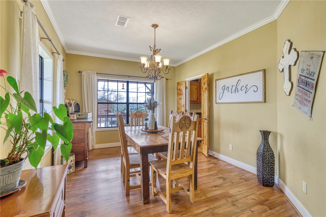 4404 County Road 151 Centerville, TX 75833 - Photo 10 of 48 a view of a dining room with furniture window and wooden floor