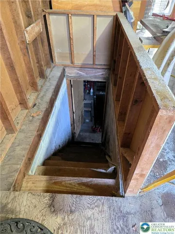 a bedroom with a bed and a mirror