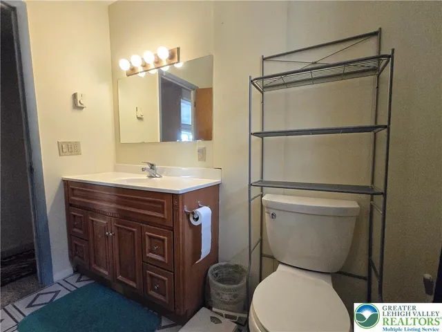 a bathroom with a glass shower door