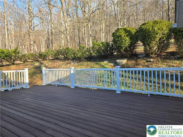 a view of a balcony with wooden floor
