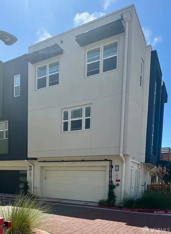 a view of house with backyard