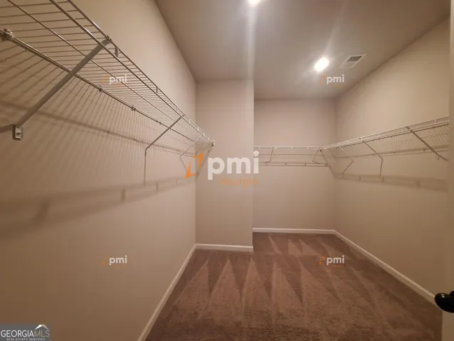 a view of a room with racks on the wall