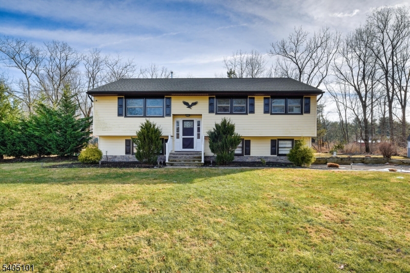 6 Elm Avenue Warren, NJ 07059 - Photo 1 of 29 a front view of house with yard and trees in the background