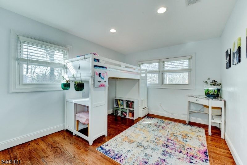 6 Elm Avenue Warren, NJ 07059 - Photo 15 of 29 a living room with furniture and a wooden floor