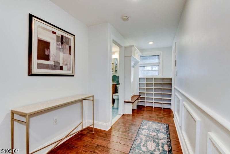 6 Elm Avenue Warren, NJ 07059 - Photo 20 of 29 a view of a hallway with workspace and wooden floor