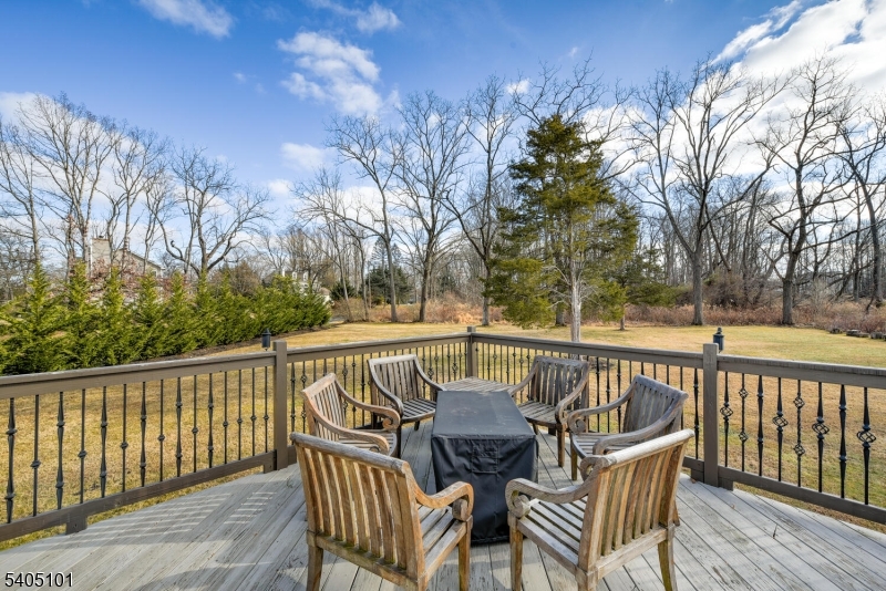 6 Elm Avenue Warren, NJ 07059 - Photo 25 of 29 a view of a wooden chairs on deck and a backyard