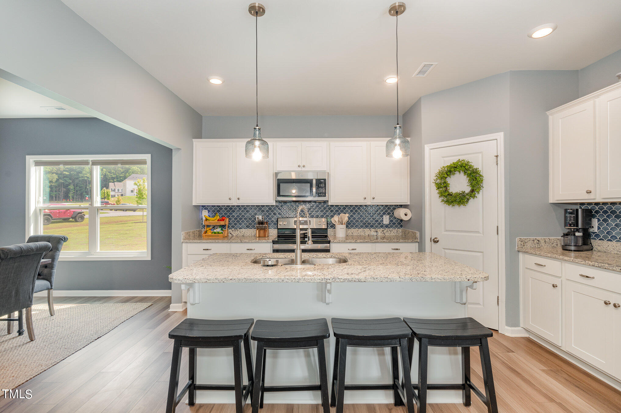 15 New Spring Way Franklinton, NC 27525 - Photo 14 of 41 a large kitchen with a table and chairs in it