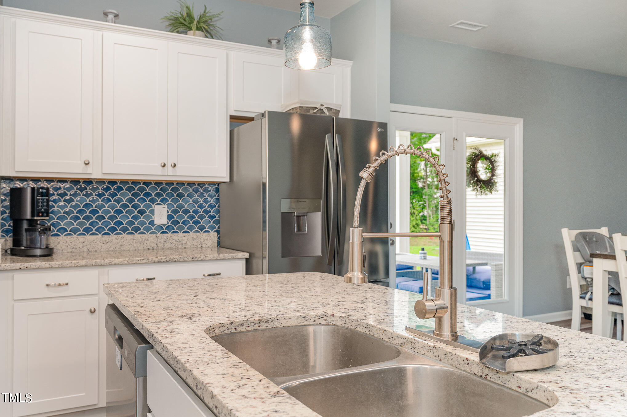 15 New Spring Way Franklinton, NC 27525 - Photo 16 of 41 a kitchen with stainless steel appliances granite countertop a sink stove and refrigerator