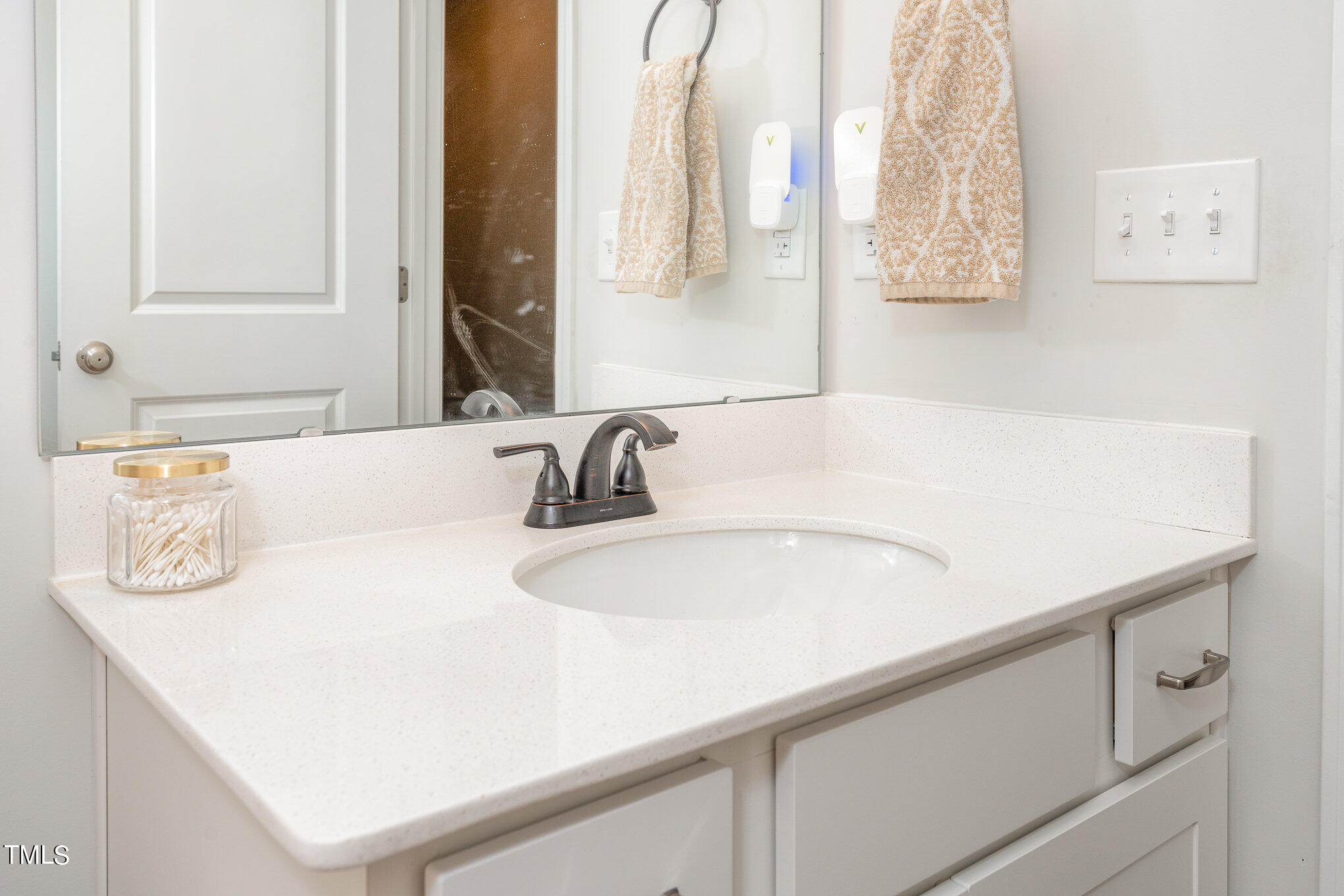 15 New Spring Way Franklinton, NC 27525 - Photo 20 of 41 a bathroom with a sink and a mirror