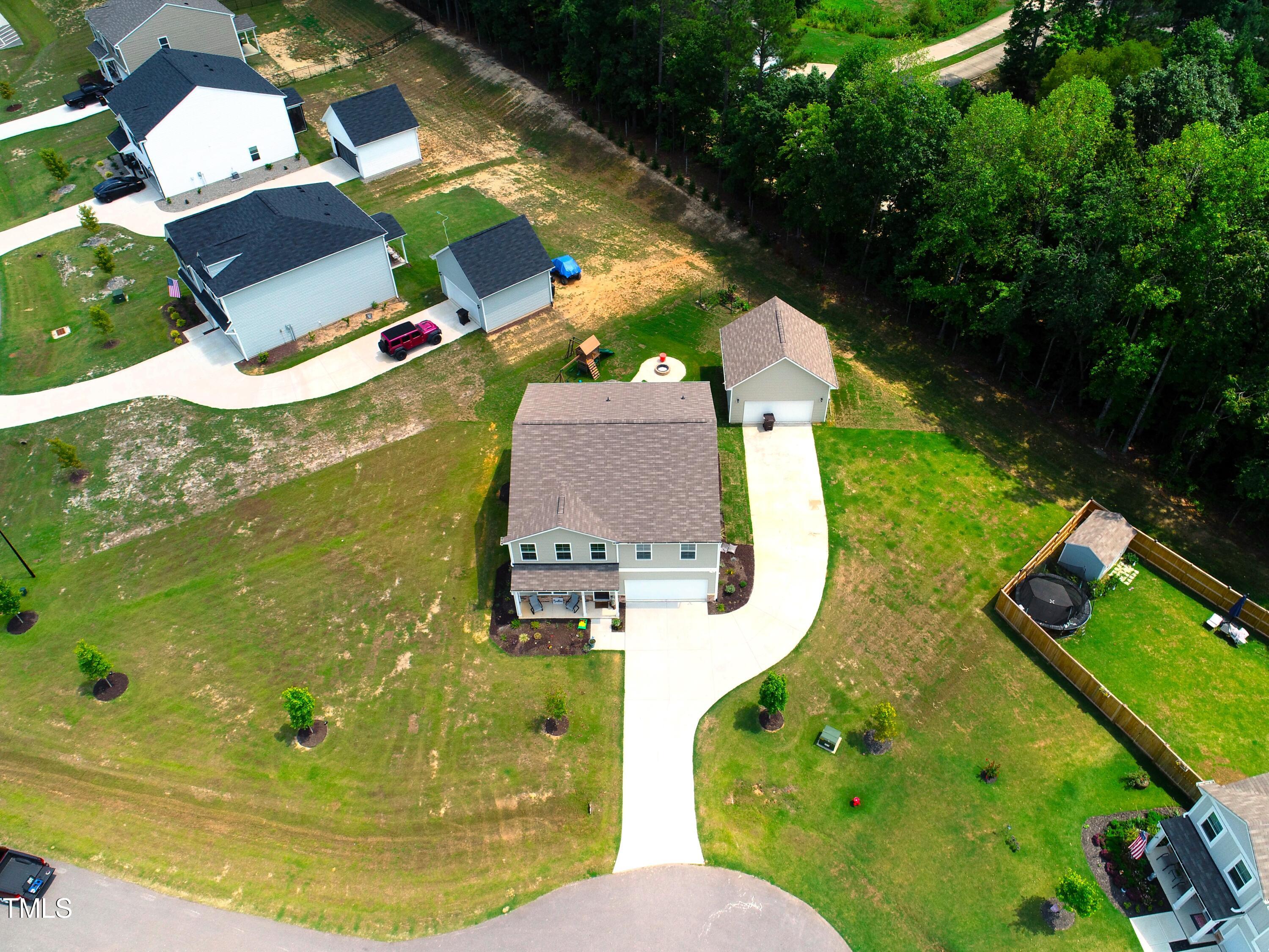 15 New Spring Way Franklinton, NC 27525 - Photo 3 of 41 an aerial view of a house with swimming pool and garden