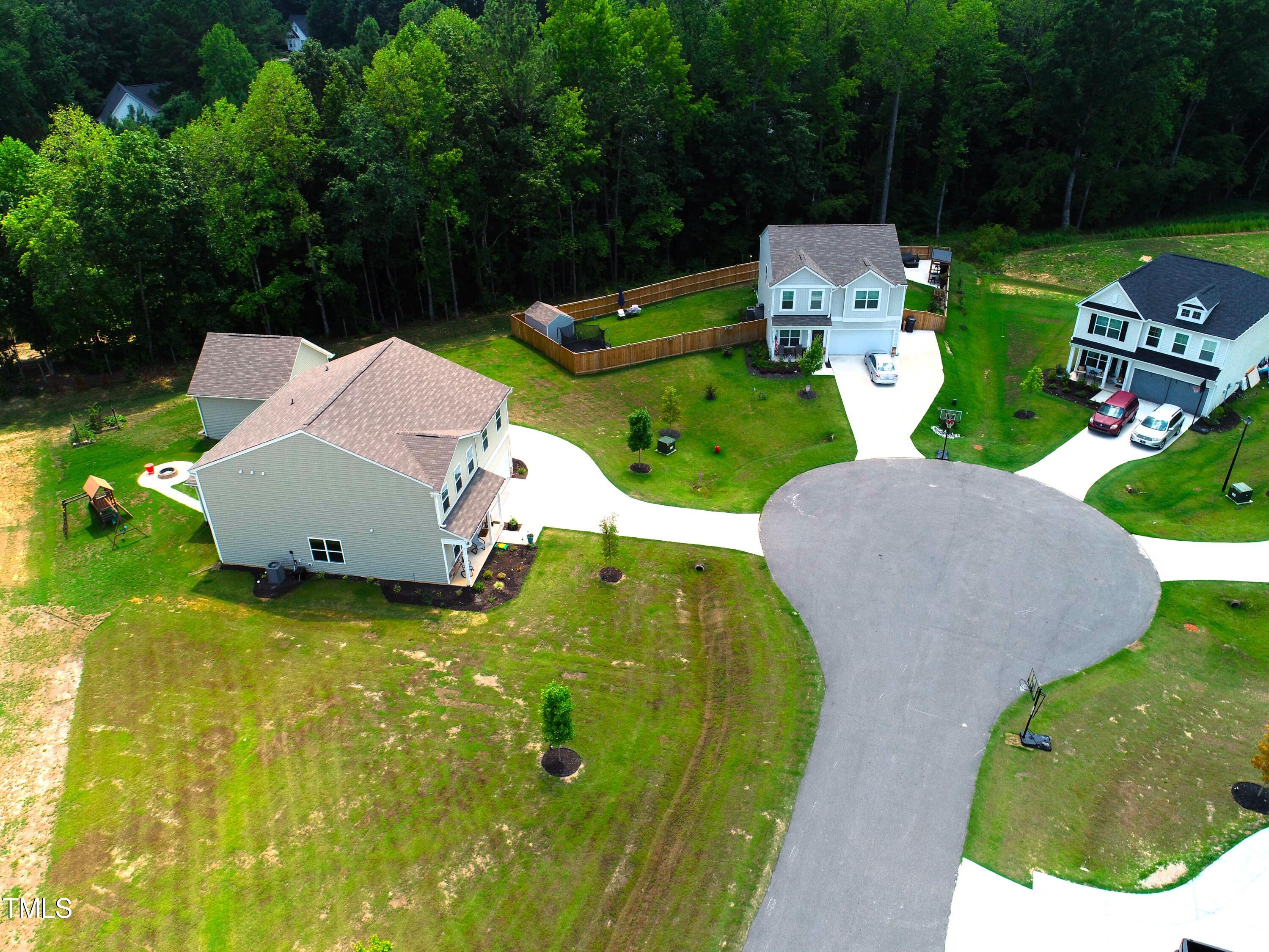 15 New Spring Way Franklinton, NC 27525 - Photo 41 of 41 an aerial view of a house with swimming pool and garden view