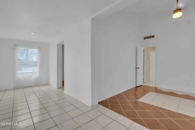 a view of an empty room and window