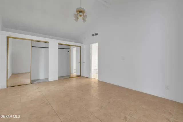 a bathroom with a granite countertop sink a toilet and a mirror