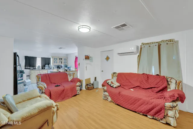 a kitchen with a dining table chairs and a stove