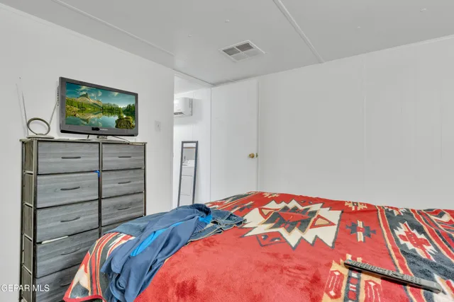 a bathroom with a bathtub a sink and a mirror