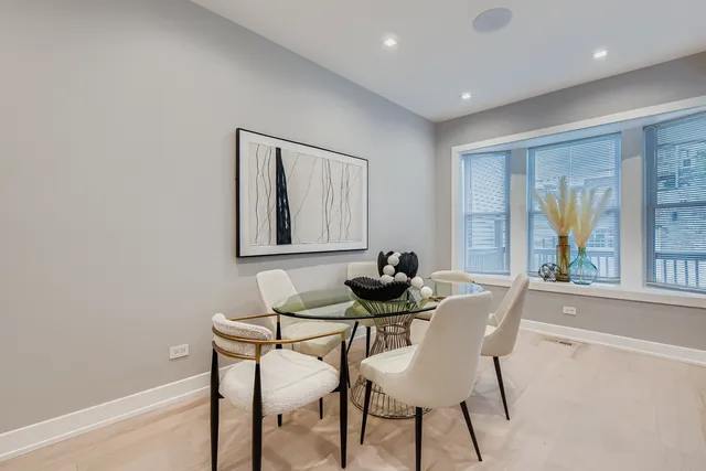 a dining room with furniture and window