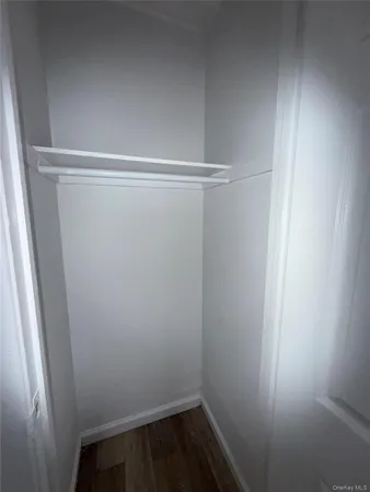 a view of a room with racks on the wall