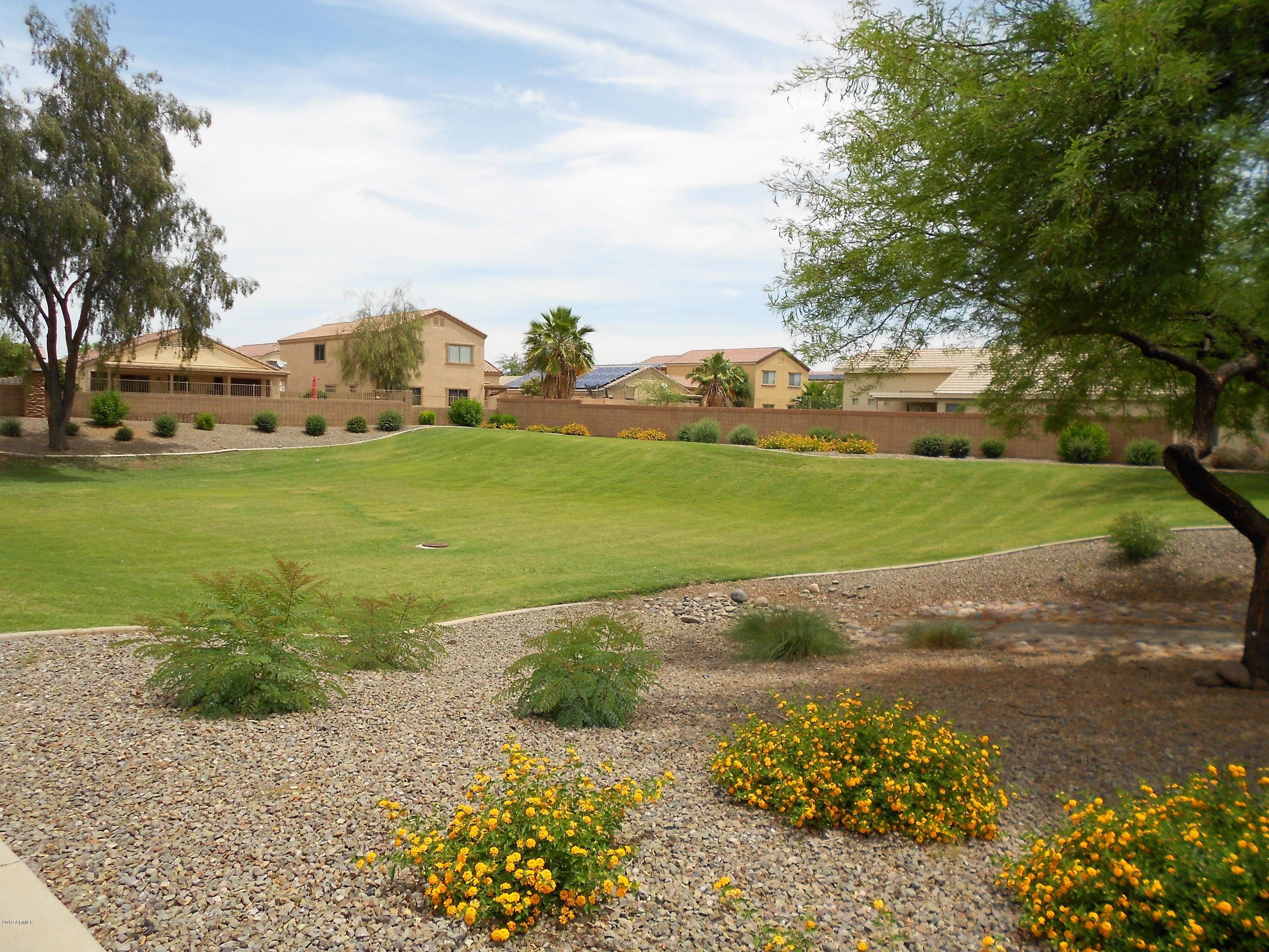 17466 West Boca Raton Road Surprise, AZ 85388 - Photo 14 of 16 a view of a field with an trees