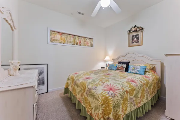 a bedroom with a bed and a table
