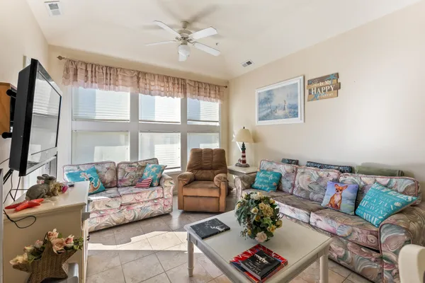 a living room with furniture and a large window