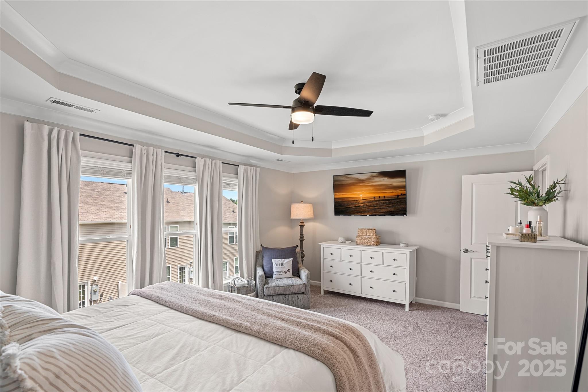 816 Canoe Song Road Fort Mill, SC 29708 - Photo 12 of 26 a bedroom with a bed and a chandelier
