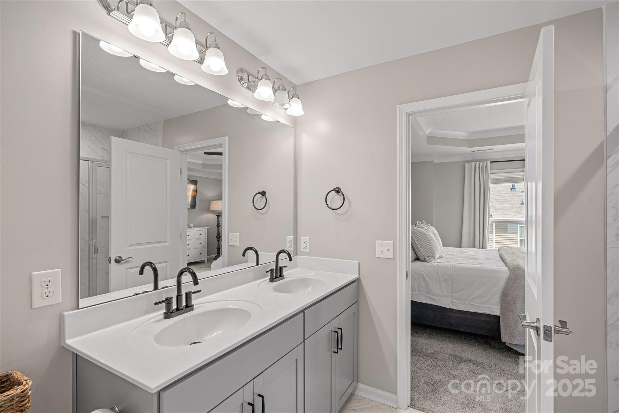 816 Canoe Song Road Fort Mill, SC 29708 - Photo 13 of 26 a en suite bathroom with a double vanity sink and a mirror