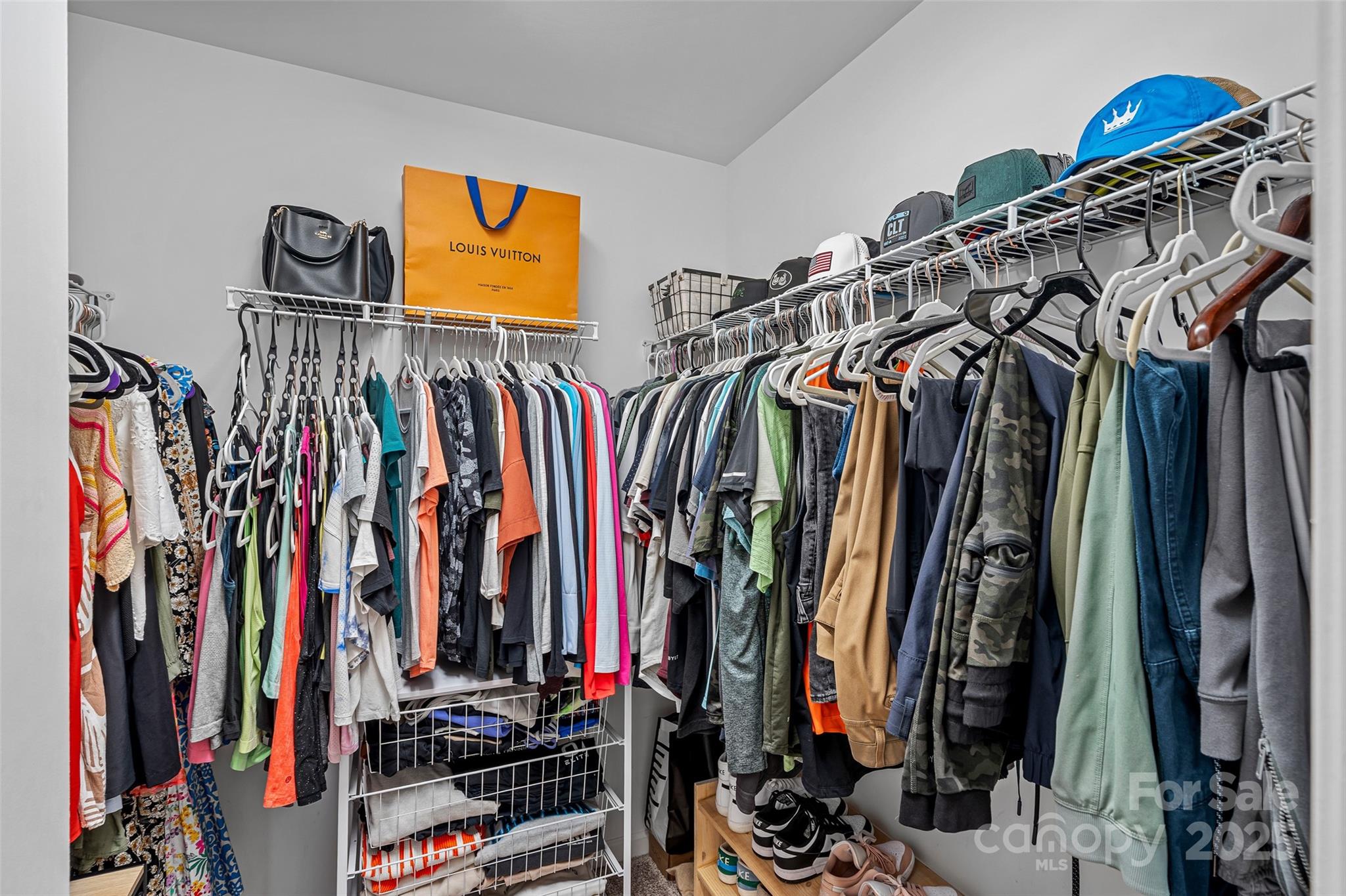 816 Canoe Song Road Fort Mill, SC 29708 - Photo 15 of 26 a view of walk in closet with clothes