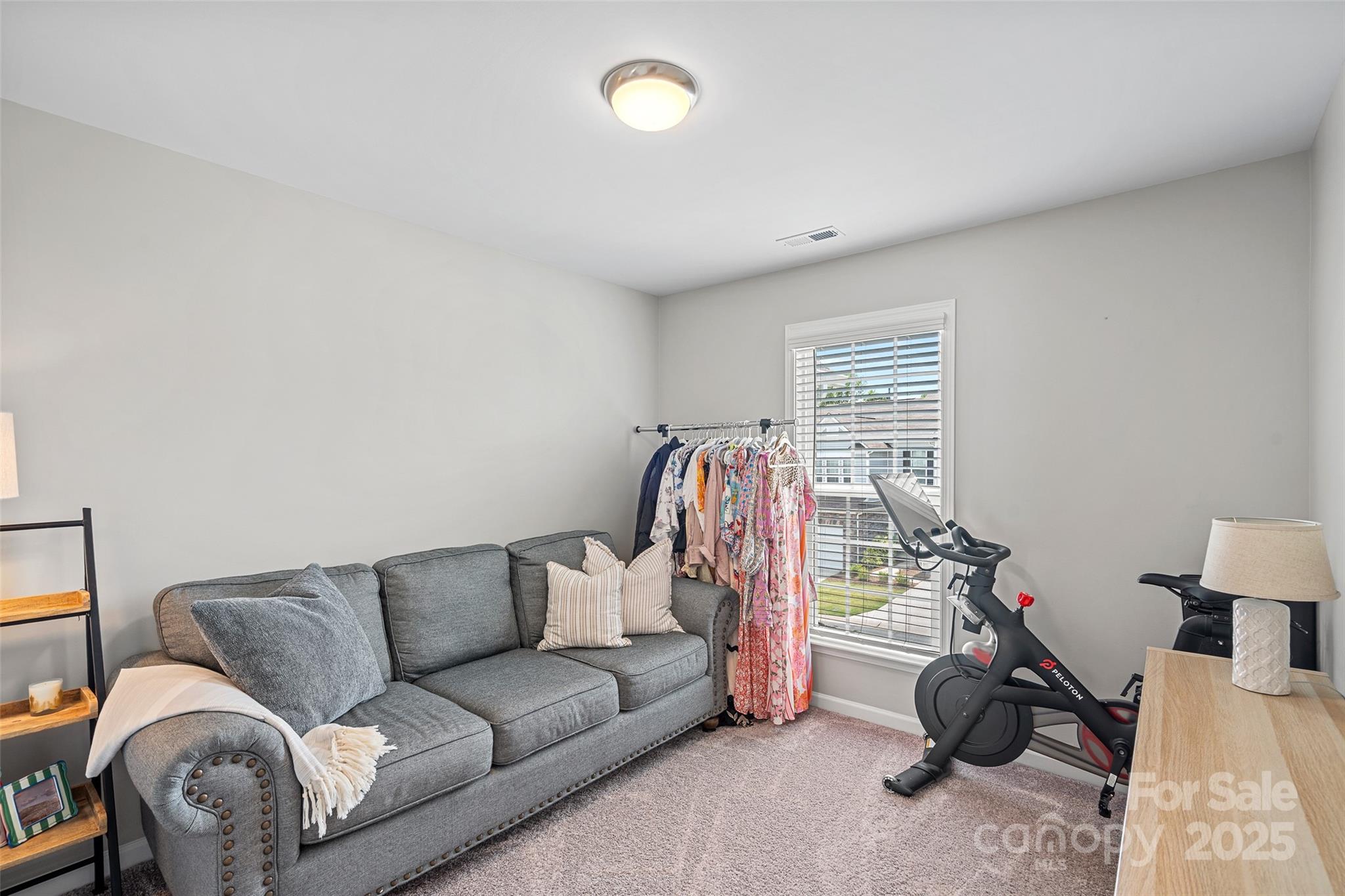 816 Canoe Song Road Fort Mill, SC 29708 - Photo 18 of 26 a living room with furniture a couch and a window