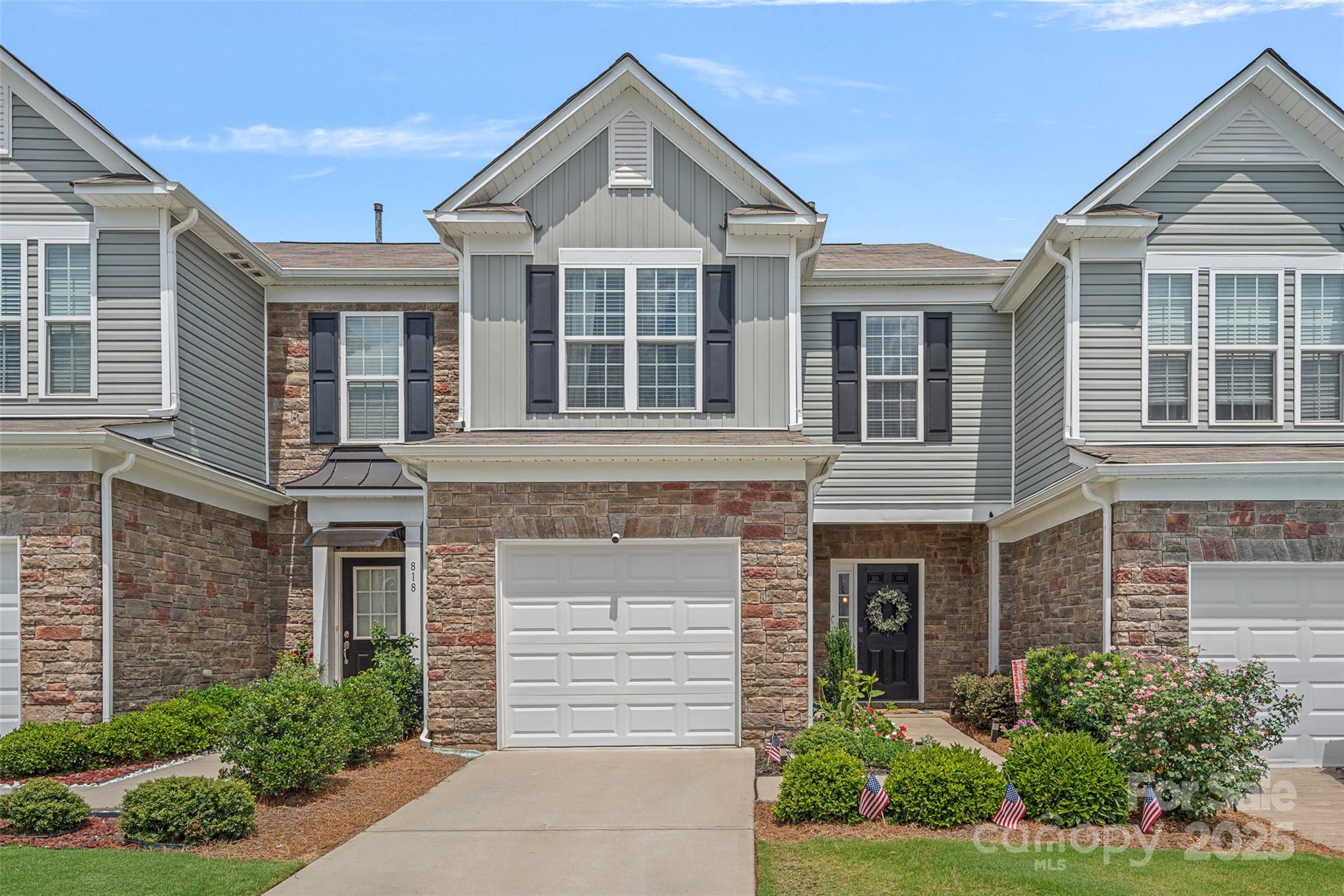 816 Canoe Song Road Fort Mill, SC 29708 - Photo 2 of 26 a front view of a house with a yard and trees