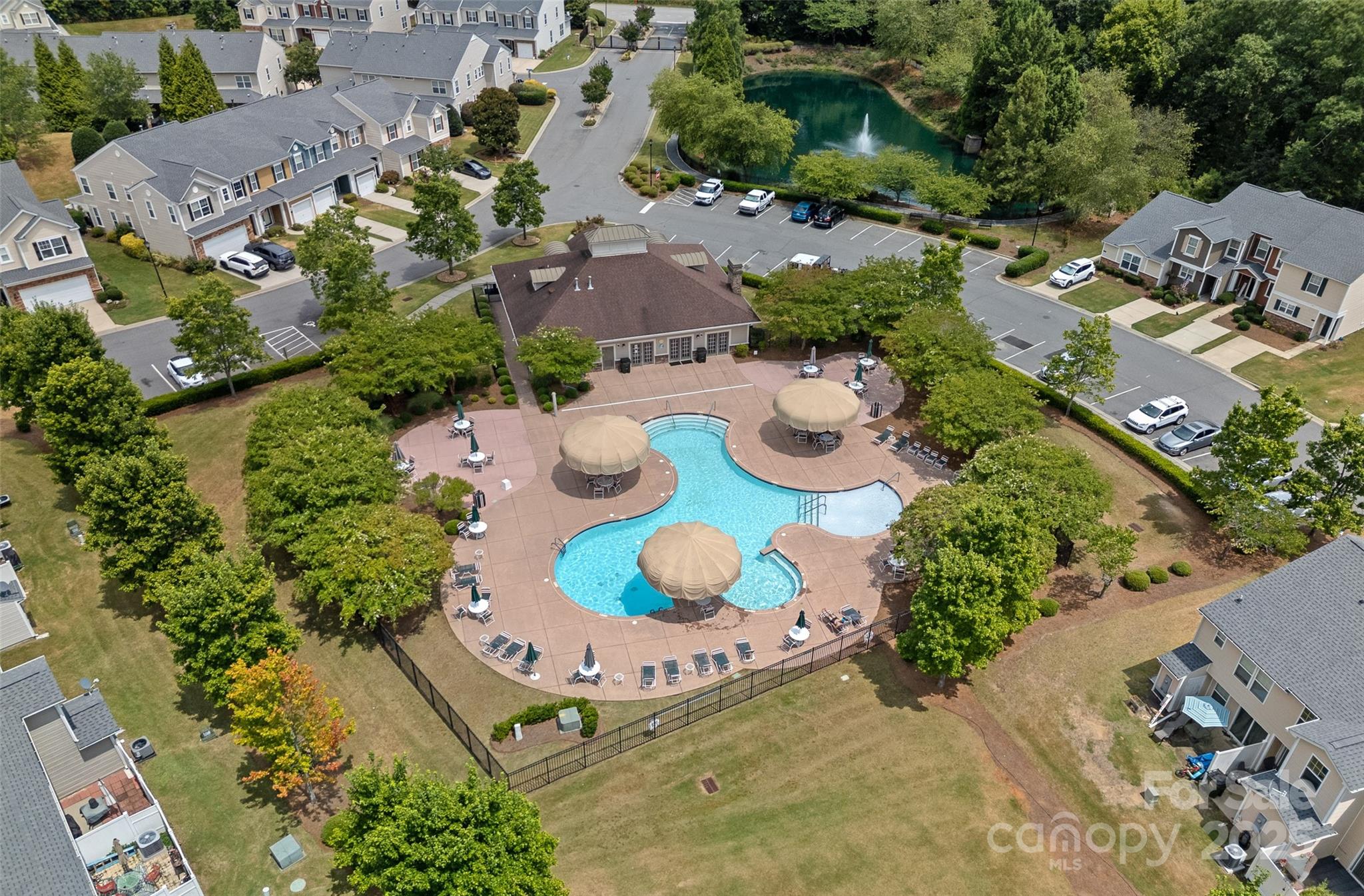 816 Canoe Song Road Fort Mill, SC 29708 - Photo 23 of 26 an aerial view of a swimming pool yard and mountain view in back