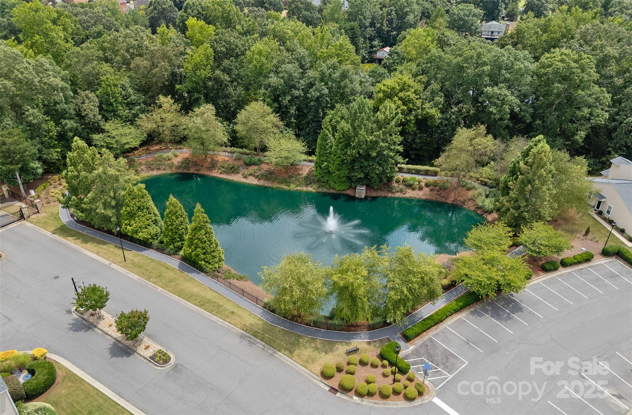 816 Canoe Song Road Fort Mill, SC 29708 - Photo 24 of 26 an aerial view of a house with a garden and lake view
