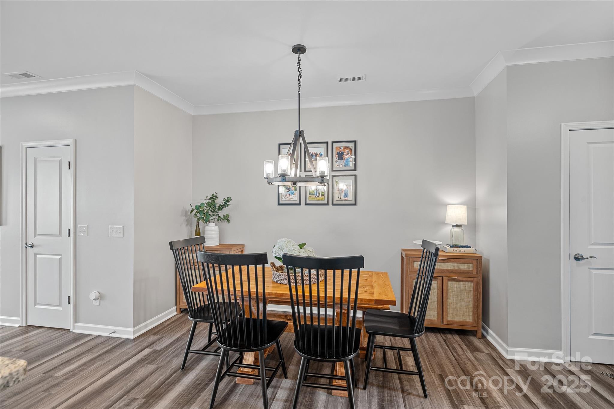 816 Canoe Song Road Fort Mill, SC 29708 - Photo 9 of 26 a view of a dining room with furniture window and wooden floor