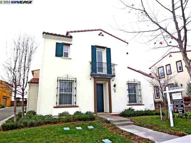 2102 Maidenhair Way San Ramon, CA 94582 - Photo 1 of 1 a view of a white house with a large windows and a yard with plants and large trees