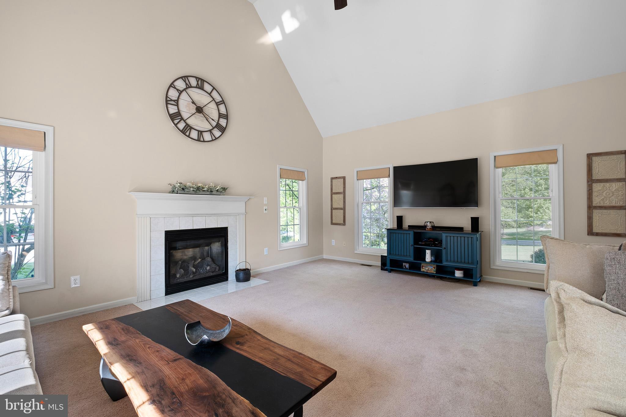 1210 Thunder Hill Road Lincoln University, PA 19352 - Photo 22 of 56 a living room with furniture a flat screen tv and a fireplace