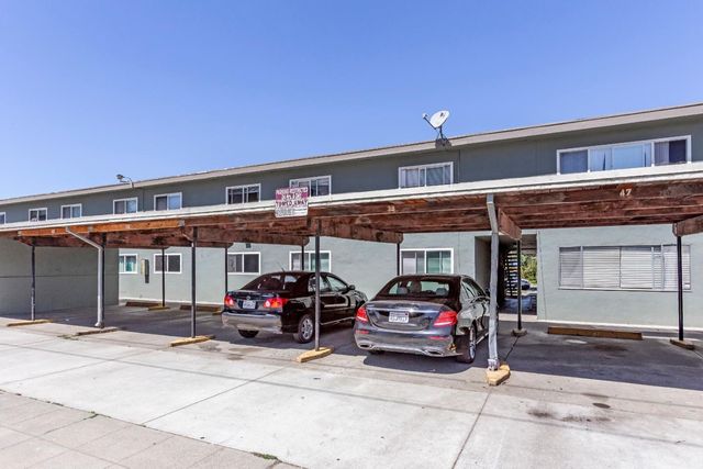 a view of a car park in front of building